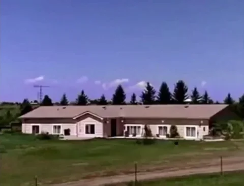 A quiet house suddenly exploding in a fireball